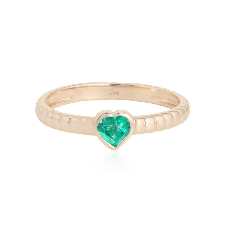 Yellow gold ring with heart-shaped emerald stone and ridged band on a white background