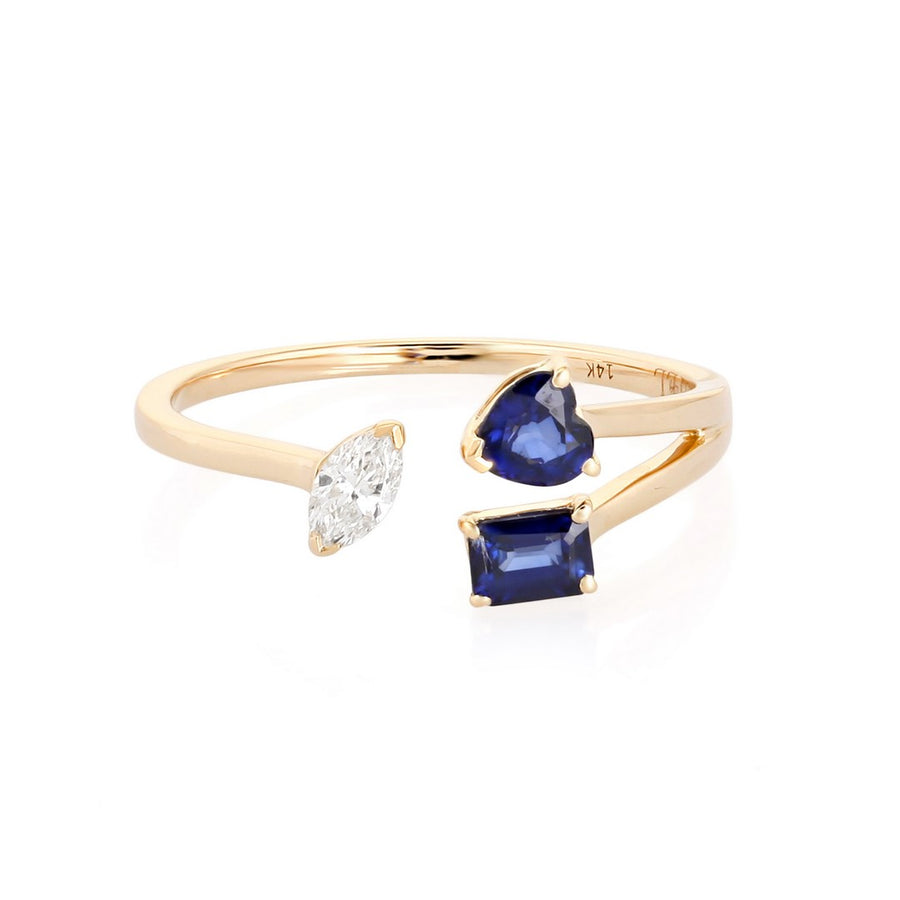 Yellow gold open bypass ring with a pear-shaped diamond and two blue sapphire stones on a white background