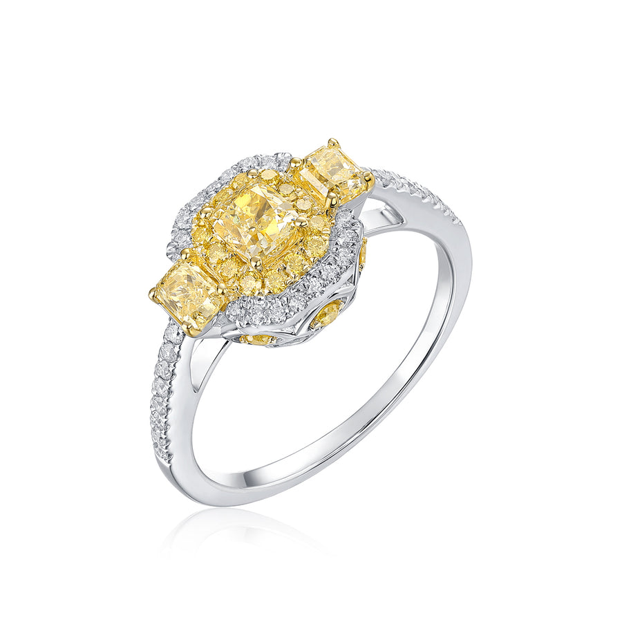 18k white gold ring with mixed-cut yellow diamond cluster and white diamond halo on a white background
