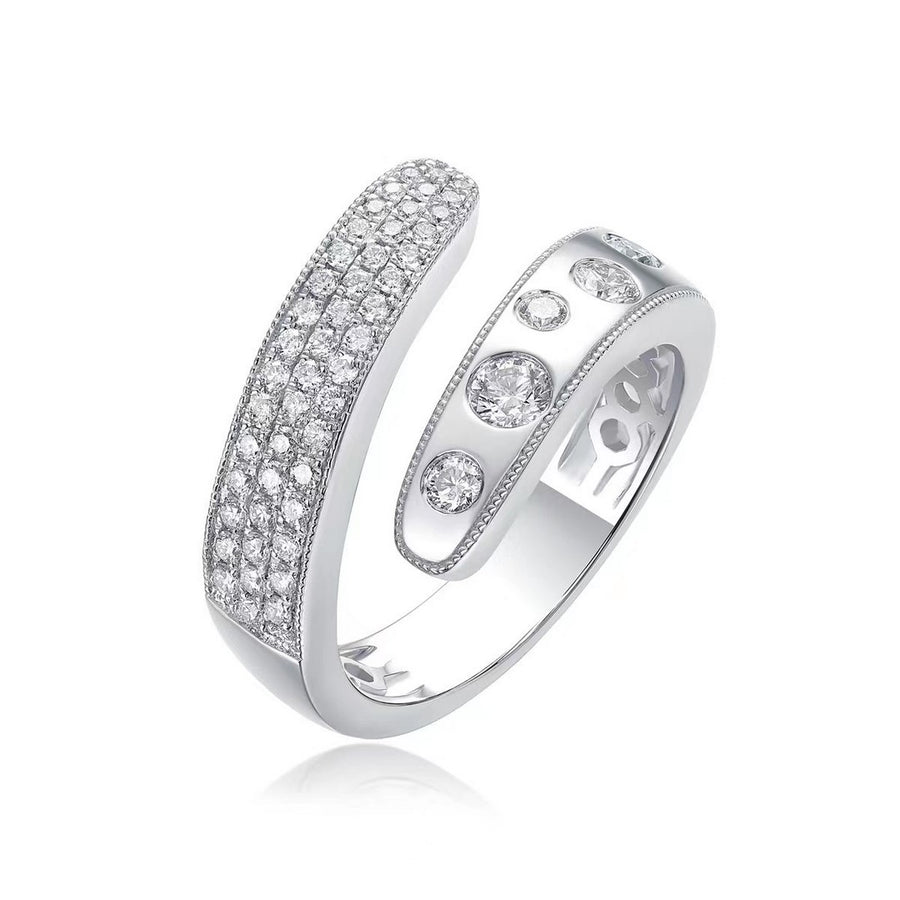 White gold open wrap ring with pave-set diamonds on one band and bezel-set round diamonds on the other band on a white background